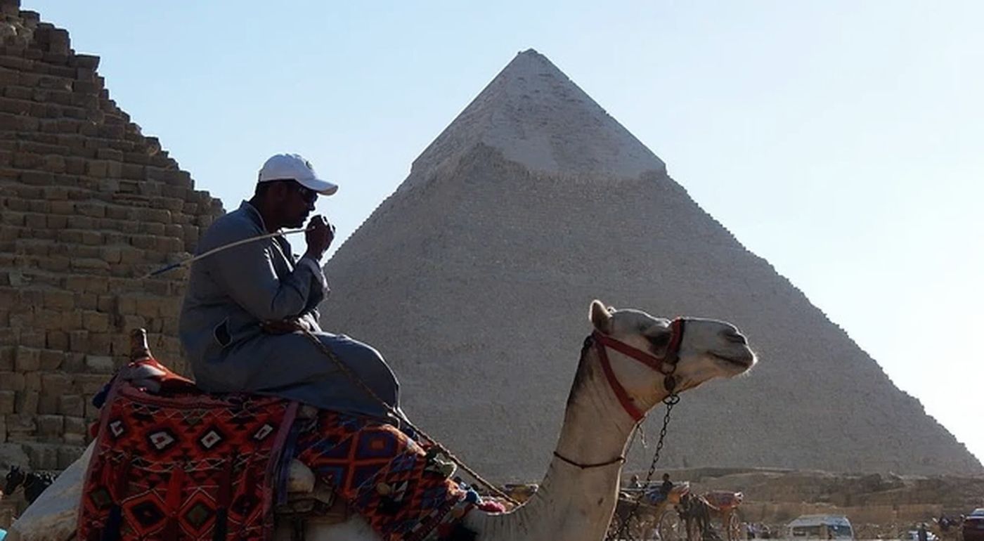 A camel and rider below the Pyramid of Khafre, Giza