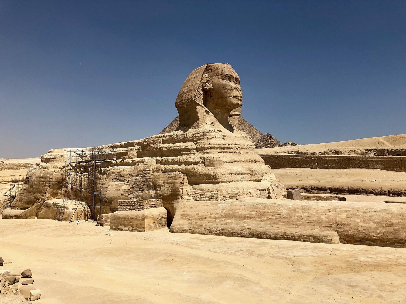 The Great Sphinx with a pyramid behind it