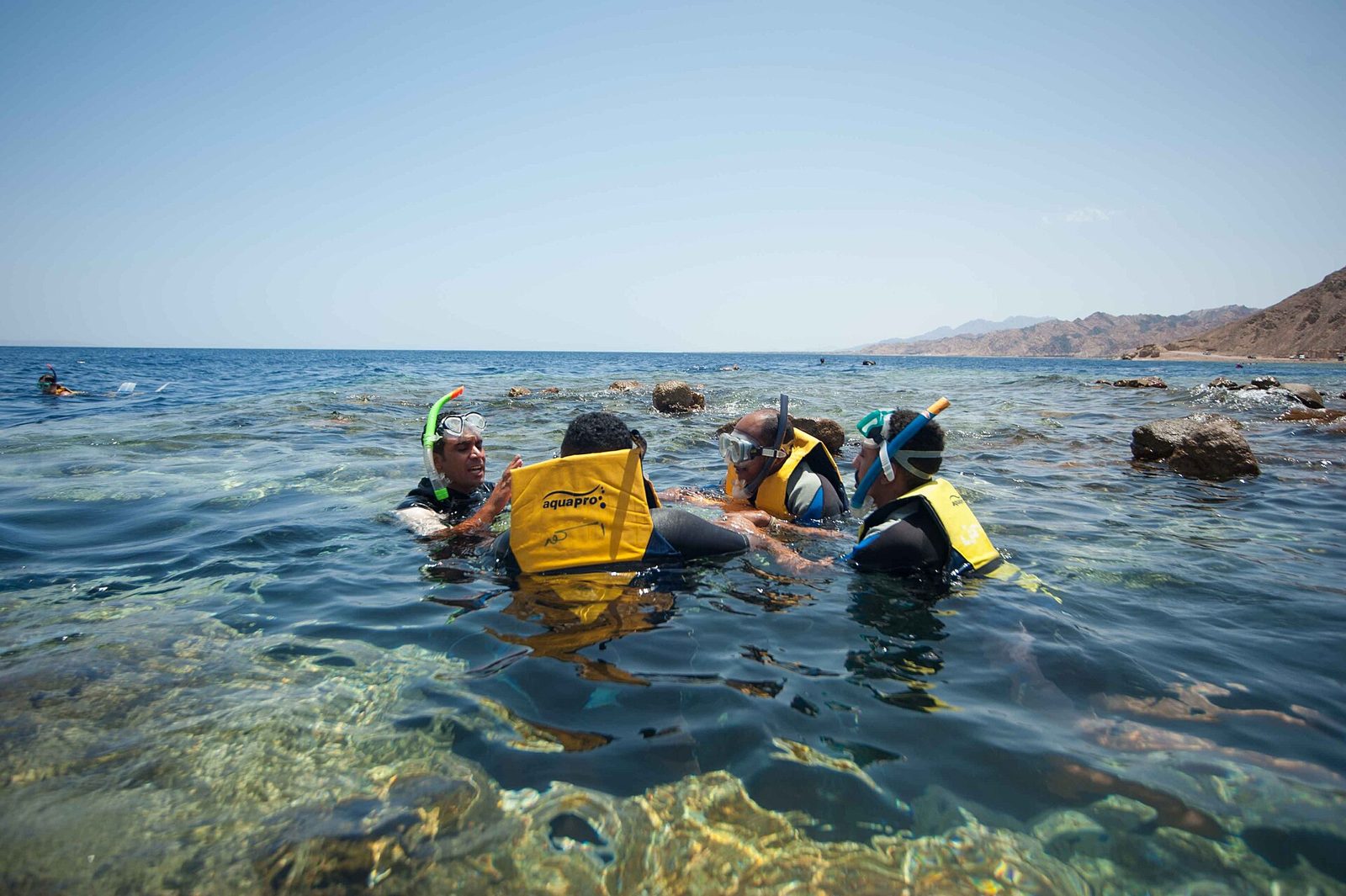 Snorkelers on the reef at the Blue Hole, Dahab